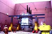Gantry hoists transformer into position